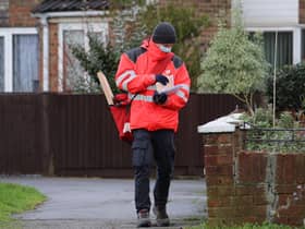 A Royal Mail delivery worker wearing a mask. Picture: PA