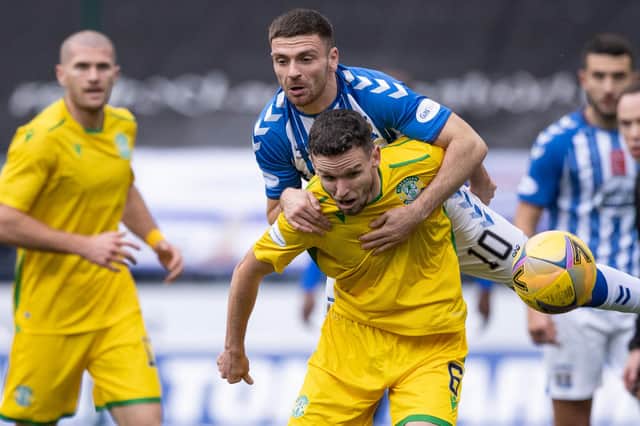 Paul McGinn holds off Kilmarnock's Greg Kiltie as Hibs' defence posted another clean sheet at Rugby Park