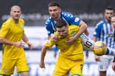 Paul McGinn holds off Kilmarnock's Greg Kiltie as Hibs' defence posted another clean sheet at Rugby Park