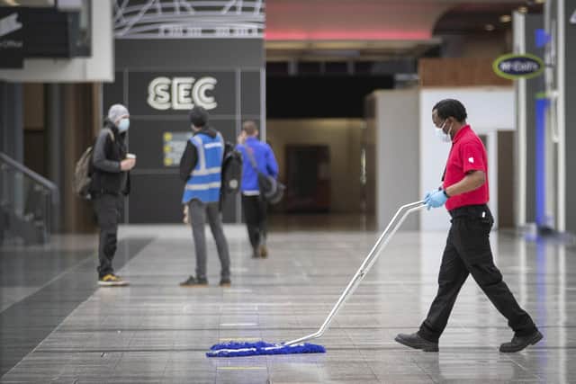 The main concourse area is cleaned at the decommissioning of the NHS Louisa Jordan hospital at the SEC, Glasgow.  Picture date: Thursday April 8, 2021.