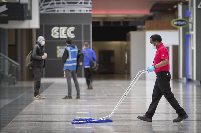 The main concourse area is cleaned at the decommissioning of the NHS Louisa Jordan hospital at the SEC, Glasgow. Picture date: Thursday April 8, 2021.