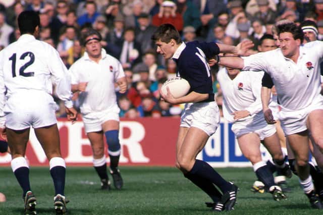 Scotland's Tony Stanger eludes the challenge from England's Peter Winterbottom (right) during the 1990 match at Murrayfield.