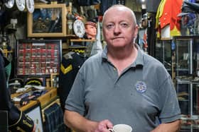 Ian Inglis with some of the exhibits at the Military Museum Scotland, PIC: Mike Wilkinson