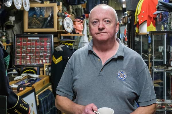 Ian Inglis with some of the exhibits at the Military Museum Scotland, PIC: Mike Wilkinson