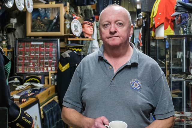 Ian Inglis with some of the exhibits at the Military Museum Scotland, PIC: Mike Wilkinson