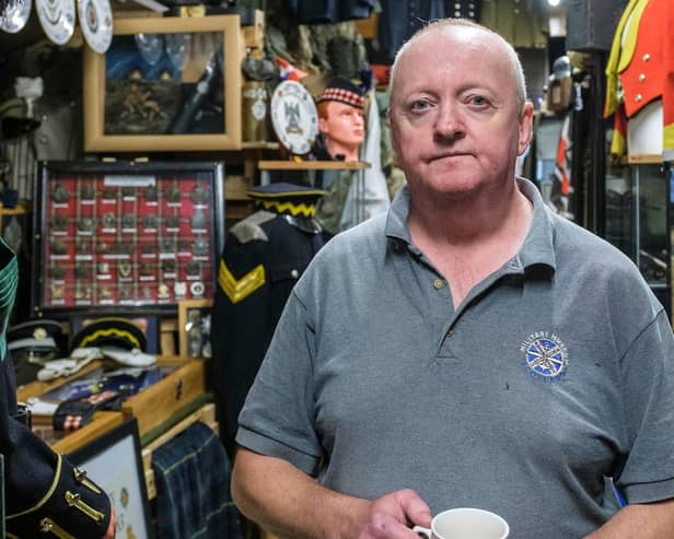 Ian Inglis with some of the exhibits at the Military Museum Scotland, PIC: Mike Wilkinson