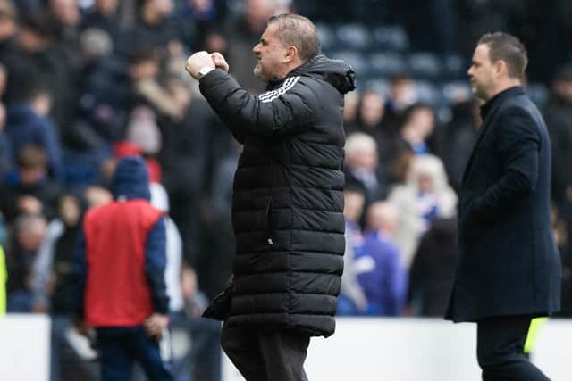 Celtic manager Ange Postecoglou celebrates, with Michael Beale in the background.