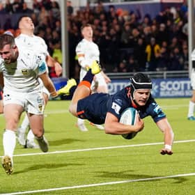 Edinburgh's Darcy Graham is airborne as he scores a second half try against Dragons.  (Photo by Simon Wootton / SNS Group)