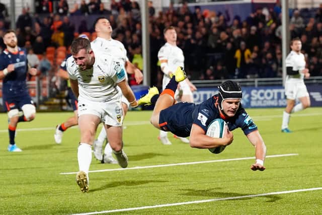 Edinburgh's Darcy Graham is airborne as he scores a second half try against Dragons.  (Photo by Simon Wootton / SNS Group)