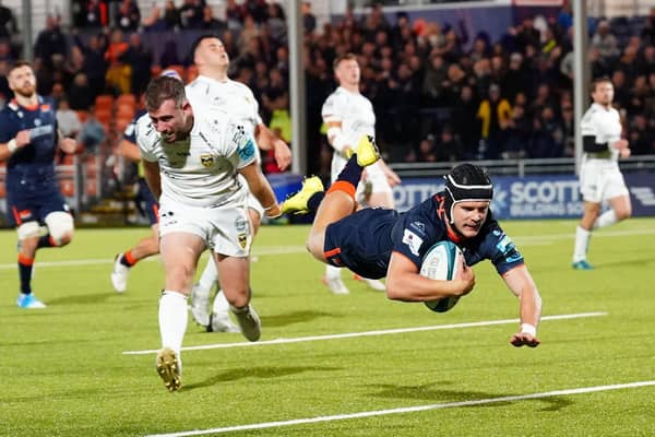 Edinburgh's Darcy Graham is airborne as he scores a second half try against Dragons.  (Photo by Simon Wootton / SNS Group)