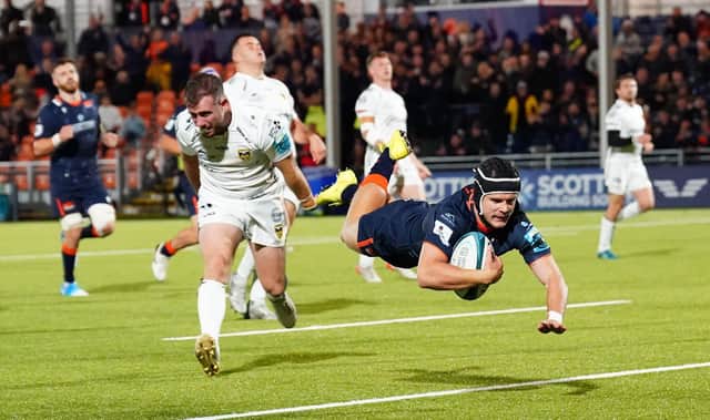 Edinburgh's Darcy Graham is airborne as he scores a second half try against Dragons. (Photo by Simon Wootton / SNS Group)