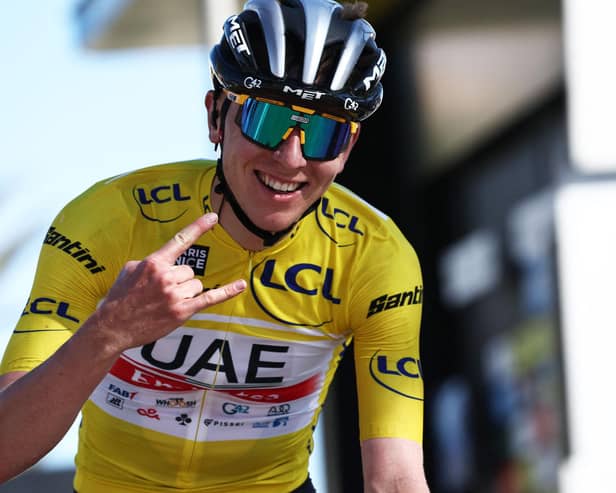 Team Emirates' Slovenian rider Tadej Pogacar celebrates as he crosses the finish line of the 8th and final stage of the 81st Paris - Nice cycling race.
