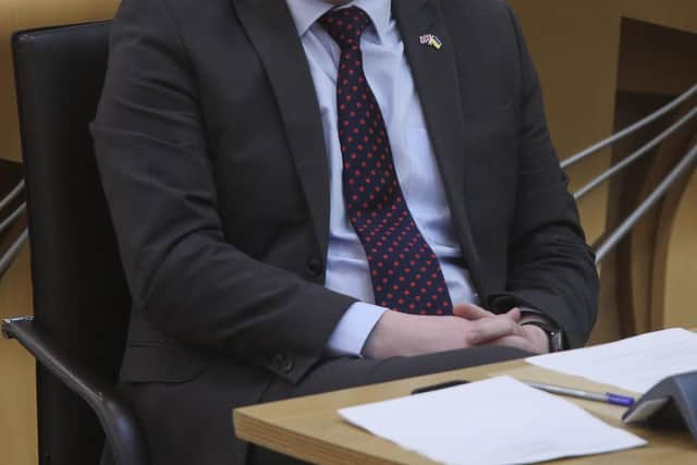 Scottish Conservative leader Douglas Ross listens to First Minister Nicola Sturgeon. Picture: Fraser Bremner/Daily Mail/PA Wire