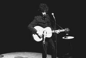 Bob Dylan performs on stage at the Olympia Theater in Paris May 25, 1966.
