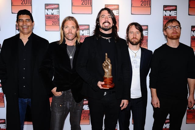 Dave Grohl (centre) with his God Like Genius award and the rest of his band Foo Fighters, at the 2011 NME Awards at the O2 Academy Brixton, London. Taylor Hawkins (second left), drummer of rock group Foo Fighters has died at the age of 50, the band has announced, saying it was "devastated by the untimely loss" and asked for the privacy of his family to be respected.