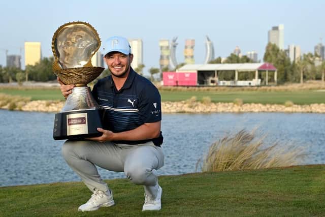 Ewen Ferguson shows off the iconic Mother of Pearl Trophy after winning the Commercial Bank Qatar Masters at Doha Golf Club last March. Picture: Stuart Franklin/Getty Images.