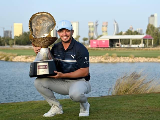 Ewen Ferguson shows off the iconic Mother of Pearl Trophy after winning the Commercial Bank Qatar Masters at Doha Golf Club last March. Picture: Stuart Franklin/Getty Images.
