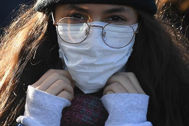 Face masks can sometimes make conversations more difficult to understand, says Bill Jamieson (Picture: Daniel Leal-Olivas/AFP via Getty Images)