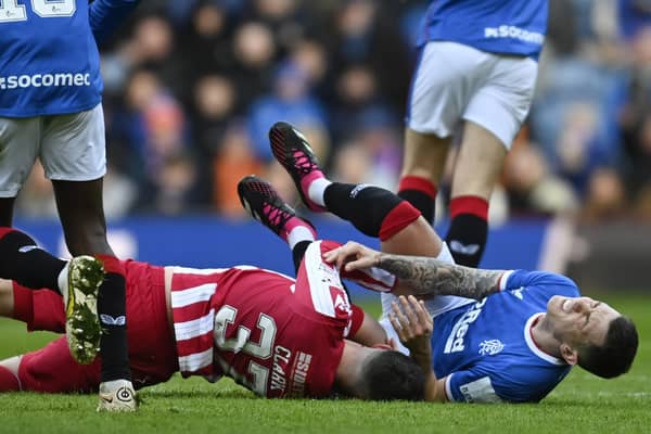 Rangers' Ryan Jack (R) is brought down by Nicky Clark in the challenge that resulted in the now overturned red card for the St Johnstone striker.  (Photo by Rob Casey / SNS Group)