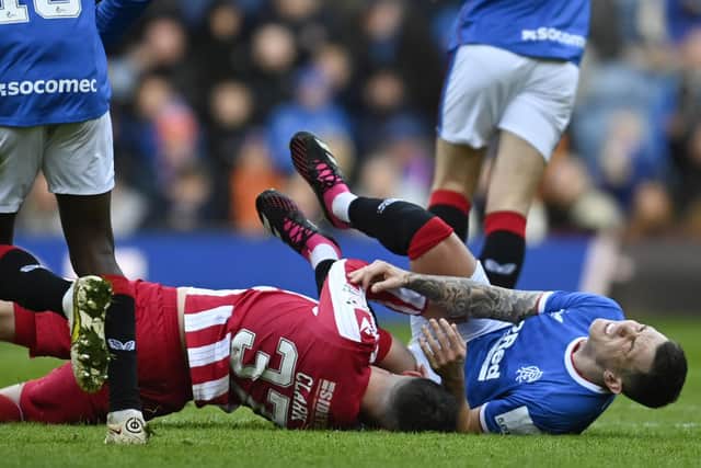 Rangers' Ryan Jack (R) is brought down by Nicky Clark in the challenge that resulted in the now overturned red card for the St Johnstone striker. (Photo by Rob Casey / SNS Group)
