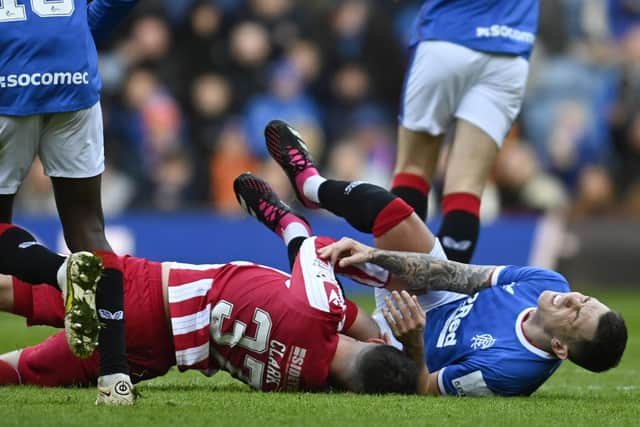 Rangers' Ryan Jack (R) is brought down by Nicky Clark in the challenge that resulted in the now overturned red card for the St Johnstone striker.  (Photo by Rob Casey / SNS Group)