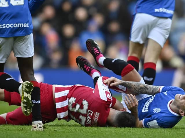 Rangers' Ryan Jack (R) is brought down by Nicky Clark in the challenge that resulted in the now overturned red card for the St Johnstone striker.  (Photo by Rob Casey / SNS Group)