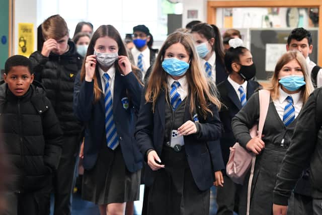 The requirement for pupils to wear masks will be lifted "as soon as possible".
