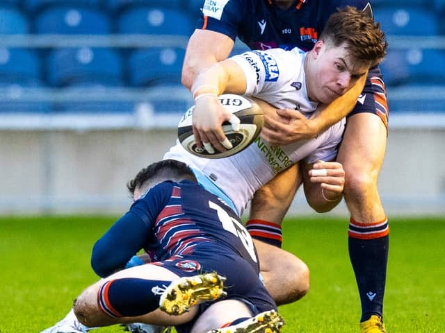 Hamish Watson, top, gets to grips with Glasgow's Huw Jones during Edinburgh's 1872 Cup win on Saturday. Picture: Ross Parker/SNS