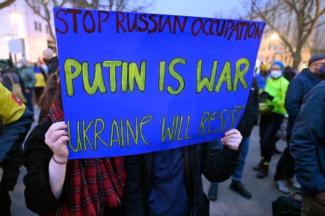 Supporters of Ukraine demonstrated in front of the Russian embassy in Berlin yesterday (Picture: John MacDougall/AFP via Getty Images)