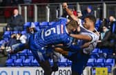St Johnstone's Liam Gordon and Rangers' Cyriel Dessers get shirty at McDiarmid Park.