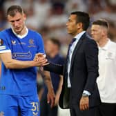 Rangers left-back Borna Barisic embraces manager Giovanni van Bronckhorst after being substituted due to an injury near the end of extra-time in the Europa League final defeat to Eintracht Frankfurt in Seville. (Photo by Alex Pantling/Getty Images)