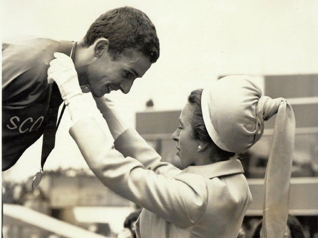 Ian Stewart is presented with his gold medal for the 5,000 metres - part of a Scottish one-two with Ian McCafferty winning silver.