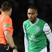 Referee Steven McLean speaks with Hibs defender Jordan Obita after his foul on St Mirren's Richard Taylor results in a penalty being awarded after a VAR check. (Photo by Ross MacDonald / SNS Group)