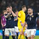 Scotland midfielder John McGinn celebrates the win over Spain.