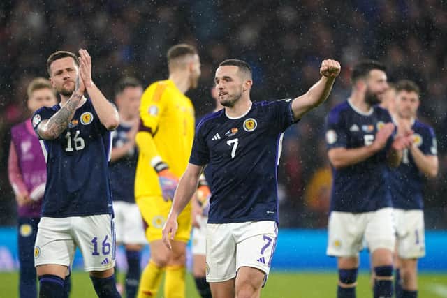 Scotland midfielder John McGinn celebrates the win over Spain.