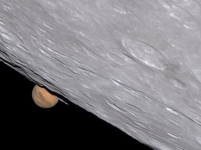 Winner
Mars-Set © Ethan Chappel 
An occultation of Mars that took place on 8 December 2022. During the occultation, the Moon passes in front of the planet Mars, allowing the astrophotographer to capture both objects together. The image shows Mars behind the Moon’s southern side in impressive detail. 
‘The occultation of Mars by the Moon was one of the last and greatest celestial events of 2022. It was also one of the most challenging to image. To capture the level of detail on Mars that you see here takes a huge amount of skill and practice. Combined with a crisp, clear, perfectly processed lunar limb, the result is like taking a gigantic telephoto lens into lunar orbit itself! This image is a technical marvel and a real treat to look at – two factors that make it a worthy winner in this category.’ - Steve Marsh
Taken with a Celestron EdgeHD 14 telescope, iOptron CEM70 mount, Astro-Physics BARADV lens, ZWO ASI462MC camera, 7,120 mm f/20, multiple 15-millisecond exposures

Location: Cibolo, Texas, USA