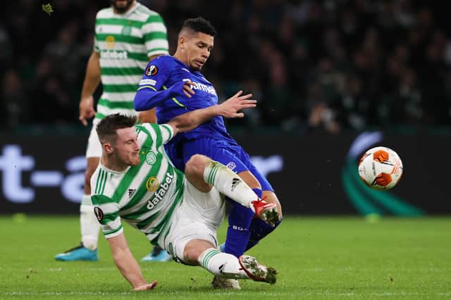 Celtic's Anthony Ralston tackles Bayer Leverkusen's Paulinho (right) is tackled by Anthony Ralston in the sides' last meeting, the 4-0 win for the Germans in September. Ange Postecoglou's men have found their best form of the season ahead of the pair locking horns again in Germany tomorrow. (Photo by Alan Harvey / SNS Group)