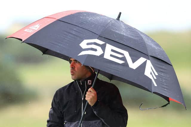 Javier Ballesteros shelters under a Seve umbrella on the Old Course. Picture: David Cannon/Getty Images.