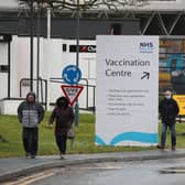People walk passed a Vaccination Centre sign at the Royal Highland Centre in Ingliston. Picture: PA Media