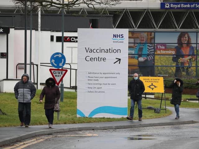 People walk passed a Vaccination Centre sign at the Royal Highland Centre in Ingliston. Picture: PA Media