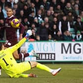 Toby Sibbick lifts the ball over Hibs goalkeeper David Marshall to make it 3-0 to Hearts against Hibs.
