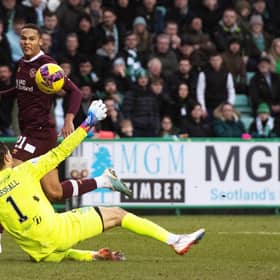 Toby Sibbick lifts the ball over Hibs goalkeeper David Marshall to make it 3-0 to Hearts against Hibs.