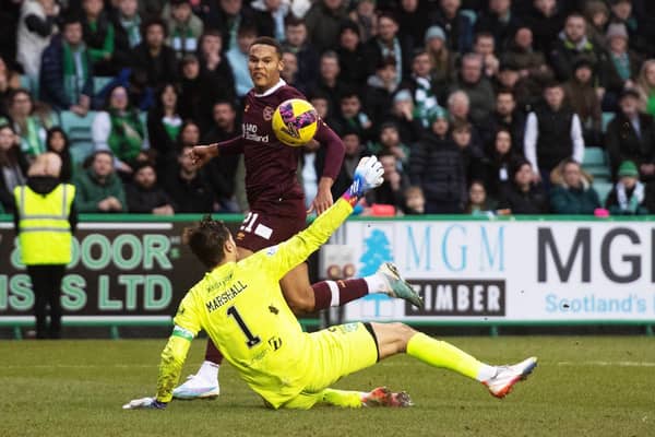 Toby Sibbick lifts the ball over Hibs goalkeeper David Marshall to make it 3-0 to Hearts against Hibs.