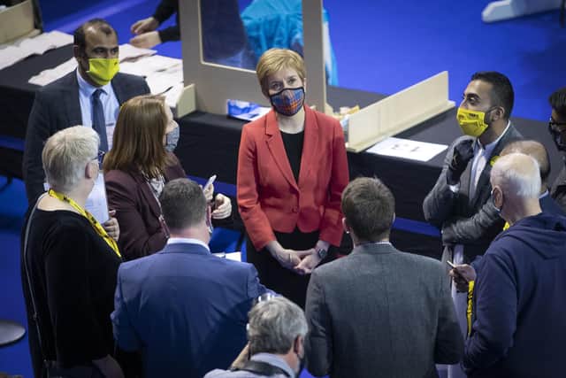 Nicola Sturgeon watches the results screen at the count for the Scottish Parliamentary Elections at the Emirates Arena, Glasgow.