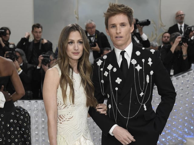 Hannah Bagshawe, left, and Eddie Redmayne wearing Alexander McQueen at the Met Gala 2023.