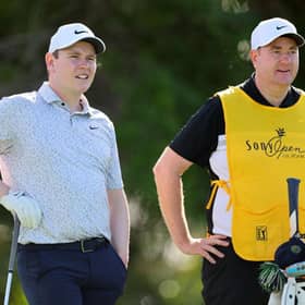 Boh MacIntyre and his caddie, Mike Burrow, size up a shot during this week's Sony Open at Waialae Country Club in Honolulu, Hawaii. Picture: Michael Reaves/Getty Images.