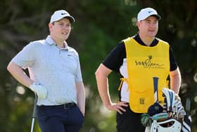 Boh MacIntyre and his caddie, Mike Burrow, size up a shot during this week's Sony Open at Waialae Country Club in Honolulu, Hawaii. Picture: Michael Reaves/Getty Images.