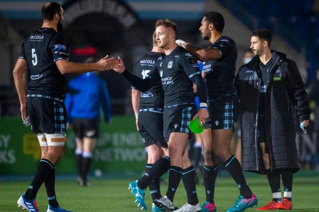 Glasgow players console Brandon Thomson, centre, after he missed a last-gasp conversion to beat the Dragons at Scotstoun in December. The Welsh side's players were less considerate. Picture: Ross MacDonald/SNS