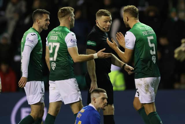 Hibs' Ryan Porteous protests the award of a penalty to referee John Beaton during a Cinch Premiership match between Hibernian and Rangers at Easter Road, on December 01, 2021, in Edinburgh, Scotland.  (Photo by Craig Williamson / SNS Group)