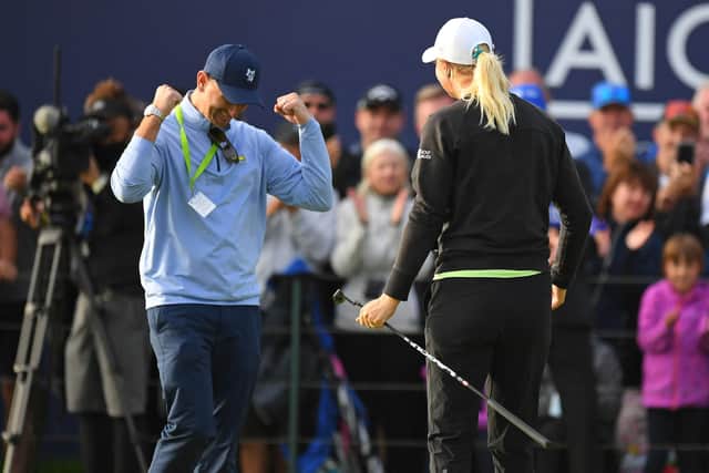 Kevin McAlpine coming on to the 18th green at Carnoustie to congratulate Anna Nordqvist after winning the AIG Women's Open. Picture. Picture: Andy Buchanan/AFP via Getty Images.